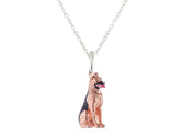 A sterling silver pendant featuring a rose gold-coated German Shepherd with black and pink enamel details on a silver chain.